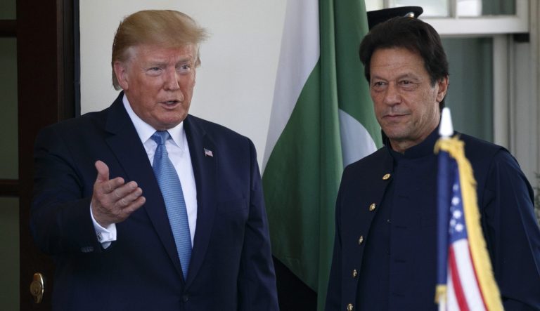 President Donald Trump gestures as he greets Pakistan's Prime Minister Imran Khan