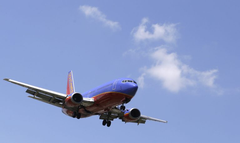 In this June 4, 2014 photo, a Southwest Airlines Boeing 737 comes in for a landing at Love Field in Dallas. The Federal Aviation Administration on Monday, July 28, 2014 is proposing a $12 million civil fine against Southwest Airlines for failing to comply in three separate cases with safety regulations related to repairs on Boeing 737 jetliners. (AP Photo/LM Otero)