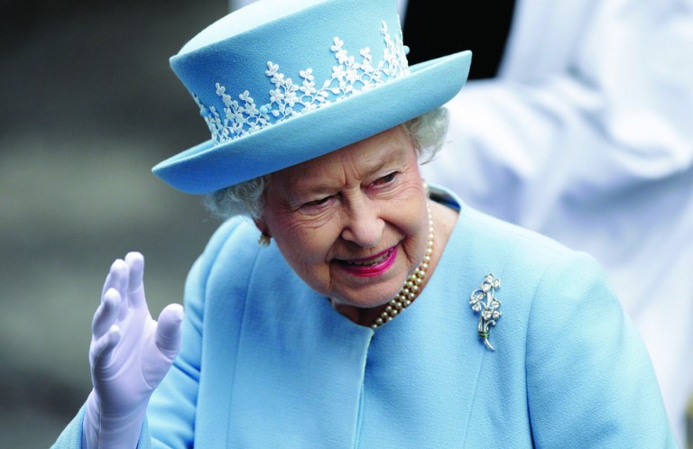 Britain's Queen Elizabeth II waves to the public as she arrives for a Service of Thanksgiving in Saint Macartin's Cathedral in Enniskillen, Northern Ireland, Tuesday, June 26, 2012. The Queen and the Duke of Edinburgh arrived in Northern Ireland for a two day visit to mark the Queen's Diamond Jubilee. (AP Photo/Peter Morrison)