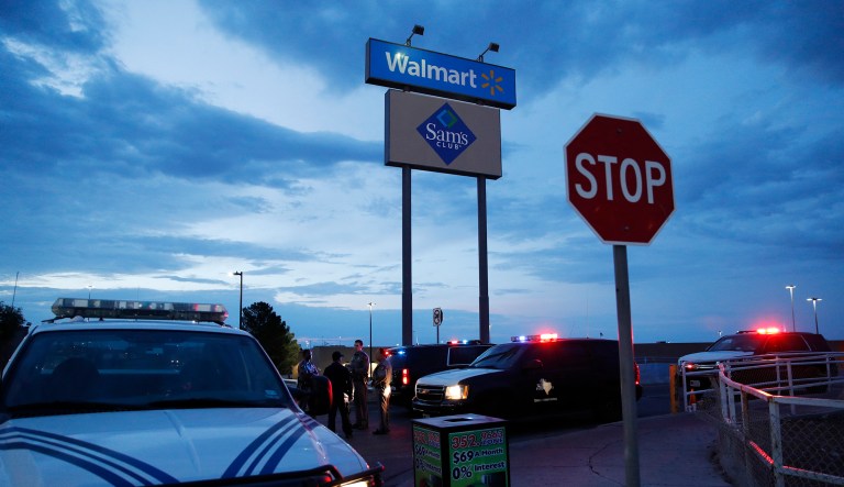 Law enforcement officials block a road at the scene of a mass shooting at a shopping complex Sunday, Aug. 4, 2019, in El Paso, Texas.