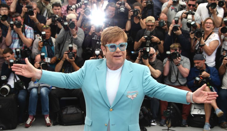 Singer Elton John poses for photographers upon arrival at the premiere of the film 'Rocketman' at the 72nd international film festival, Cannes, southern France, Thursday, May 16, 2019.