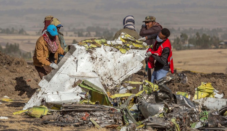 Rescue workers at  Bishoftu (Debre Zeit), Ethiopia, Monday, March 11, 2019, where Ethiopia Airlines Flight 302 crashed.