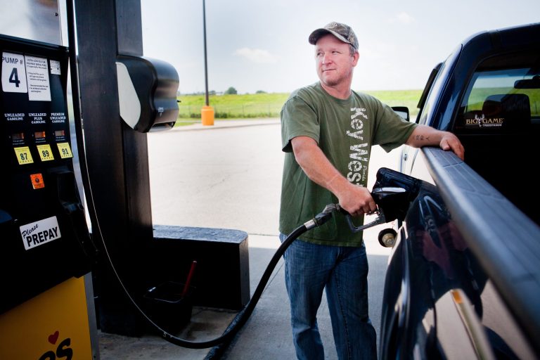 FILE - In this July 1, 2014 file photo, Lance Thompson pumps gas into his truck at a Love's station in St. Joseph, Mo. The Labor Department reports on U.S. consumer prices in August on Wednesday, Sept. 17, 2014. (AP Photo/St. Joseph News-Press, Sait Serkan Gurbuz, File)