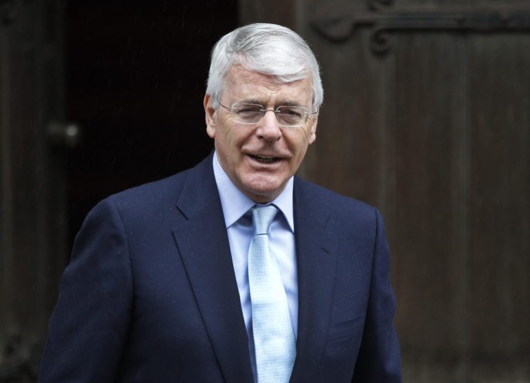   Former British Prime Minister John Major poses for photographers as he arrives to give evidence to the Leveson inquiry at the Royal Courts of Justice in central London, Tuesday, June 12, 2012. The Leveson inquiry is Britain's media ethics probe that was set up in the wake of the scandal over phone hacking at Rupert Murdoch's News of the World, which was shut in July 2011 after it became clear that the tabloid had systematically broken the law. (AP Photo/Lefteris Pitarakis)  