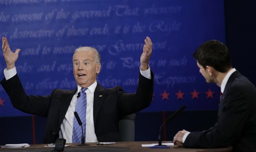 Republican vice presidential nominee Rep. Paul Ryan, of Wisconsin, right, watches as Vice President Joe Biden, speaks during the vice presidential debate at Centre College, Thursday, Oct. 11, 2012, in Danville, Ky. (AP Photo/David Goldman)