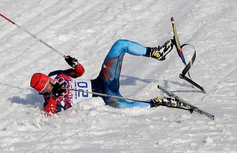 Russia's Anton Gafarov falls with a broken ski during his men's semifinal of the cross-country sprint at the 2014 Winter Olympics, Tuesday, Feb. 11, 2014, in Krasnaya Polyana, Russia. (AP Photo/Matthias Schrader)