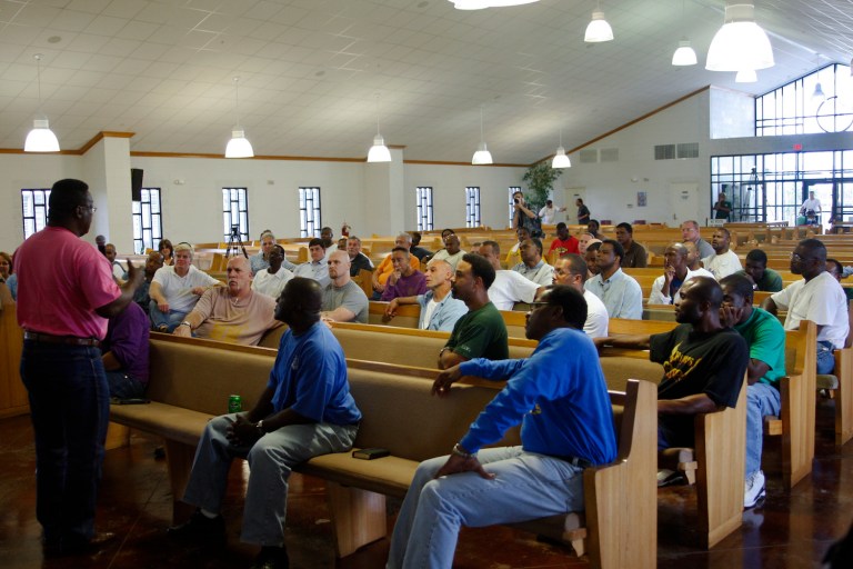 Inmates seated at a chapel located at the Louisiana State Penitentiary (Angola). As the seminary has grown, violence in Angola has diminished. (AP Photo/Judi Bottoni)
