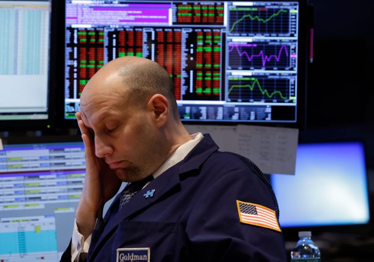 FILE - In this Wednesday, March 19, 2014, file photo, Specialist Meric Greenbaum works at his post on the floor of the New York Stock Exchange. 2014. U.S. stocks are falling in midday trading Monday, March 24, 2014, as tensions with Russia escalate. (AP Photo/Richard Drew, File)