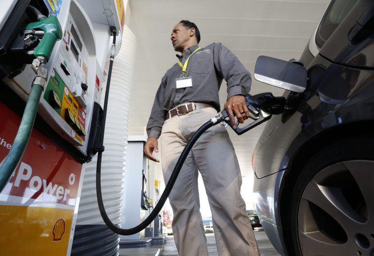 FILE - In this Friday March 7, 2014 file photo, Eric Henry puts gasoline in his car in Sacramento, Calif. Despite a bipartisan push, the Senate's Democratic leaders have so far derailed efforts to halt an increase in the price  of gasoline and other fuels that will hit consumers in January 2015. (AP Photo/Rich Pedroncelli, File)
