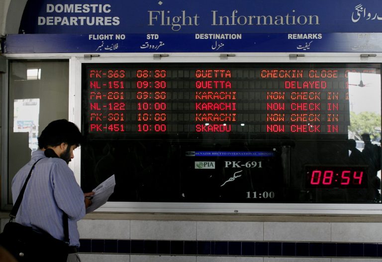 In this Saturday, June 8, 2013 photo, a passenger checks his e-ticket at Benazir Bhutto airport in Islamabad, Pakistan. Most of Pakistan's planes are more than 25 years old and not in the best of shape, its staff is bloated, and every flight is probably costing the state money instead of adding to its bottom line, with the carrier losing some $300 million a year. That's emblematic of the problems with Pakistan's state-owned enterprises, underlining how difficult it will be for Prime Minister Nawaz Sharif to carry out a key promise for rebuilding the economy, rescuing, reforming and possibly privatizing a slew of state companies. (AP Photo/Anjum Naveed)