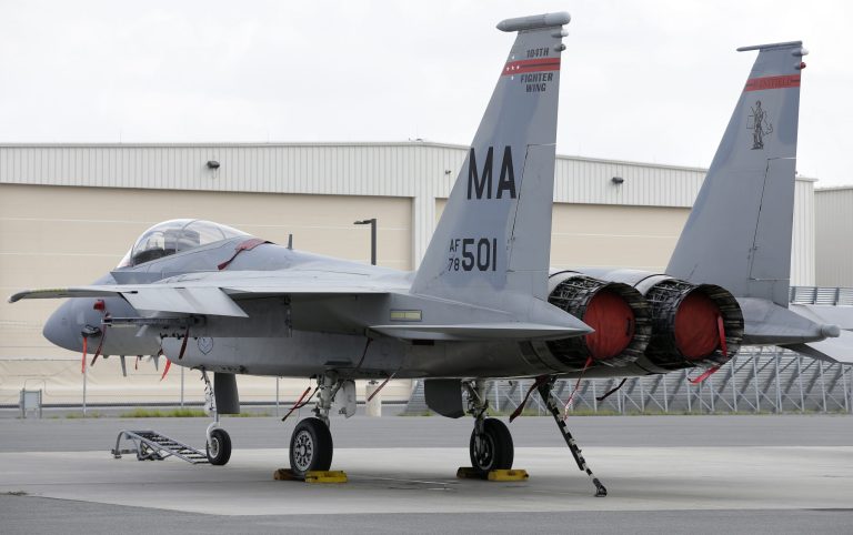 A Massachusetts Air National Guard F-15C fighter aircraft sits near a hangar at Barnes Air National Guard Base, in Westfield, Mass., in this Aug. 27, 2014 file photo. (AP Photo/Steven Senne, File)