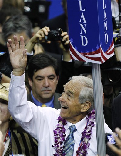 Rep. Ron Paul, R-Texas, waves to supporters as he arrives on the convention floor. (AP Photo)