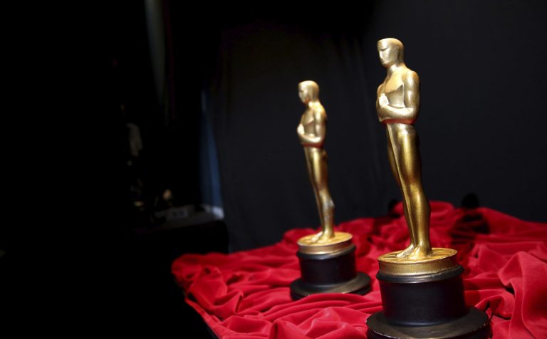 A pair of prop Oscars are seen backstage during rehearsals for the 86th Academy Awards in Los Angeles, Friday, Feb. 28, 2014. The Academy Awards will be held at the Dolby Theatre on Sunday, March 2. (Photo by Matt Sayles/Invision/AP)