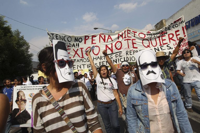   Students belonging to the 132 movement march towards the second presidential debate site in Guadalajara, Mexico, Sunday June 10, 2012. Tens of thousands young demonstrators clogged Mexico City streets Sunday to protest the likely return to power of the country's long-ruling party. (AP Photo/Bruno Gonzalez)  