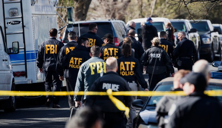 Authorities work on the scene of an explosion in Austin on Monday, March 12, 2018. Two package bomb blasts a few miles apart killed a teenager and wounded two women in Austin on Monday, less than two weeks after a similar attack left a man dead in another part of the Texas capital.