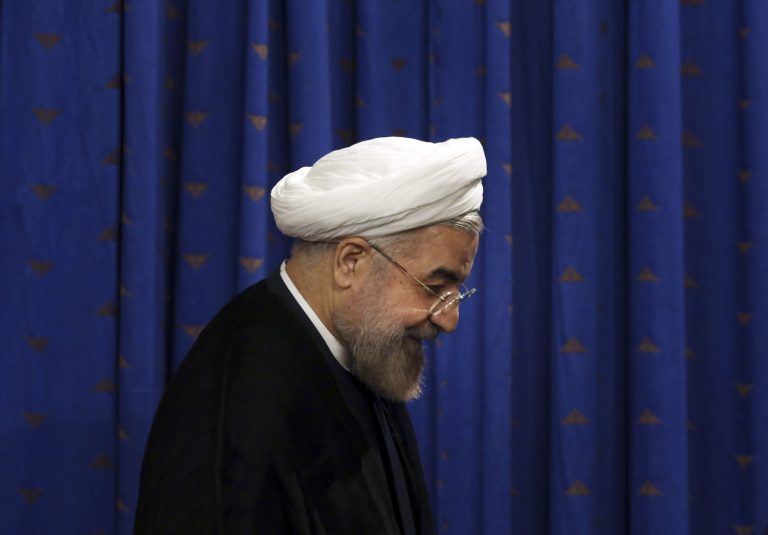 Iranian President Hassan Rouhani leaves after a press conference in Tehran, Iran, Saturday, June 14, 2014. Rouhani says the international sanctions regime has crumbled and will not be rebuilt even if Iran and world powers fail to reach a final nuclear deal by a July 20 deadline. Iran and the five permanent members of the U.N. Security Council plus Germany reached an interim deal in November that limited Iran's uranium enrichment program in exchange for the easing of some sanctions. (AP Photo/Vahid Salemi)