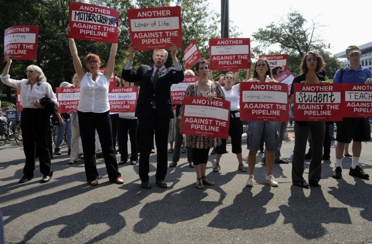 Protestors against the Keystone Pipeline rally outside the State Department in Washington, Monday, Aug. 12. (AP/Susan Walsh)
