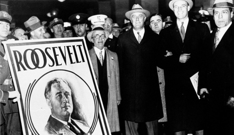Franklin D. Roosevelt, arriving at Town Hall, Hyde Park, New York, one mile from his home, to vote November 6, 1928. (AP Photo)