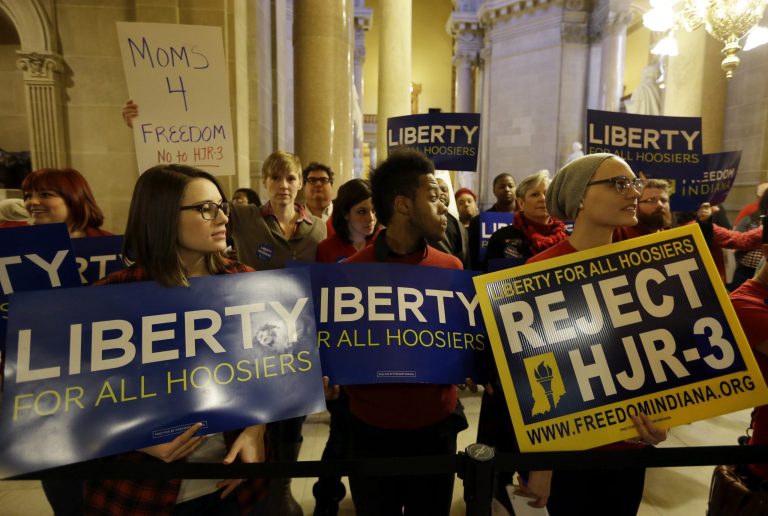 Protestors against a proposed amendment to the state's constitution to ban gay marriage gather outside a hearing of the House elections committee at the Statehouse in Indianapolis on Jan. 22. (AP/Michael Conroy)