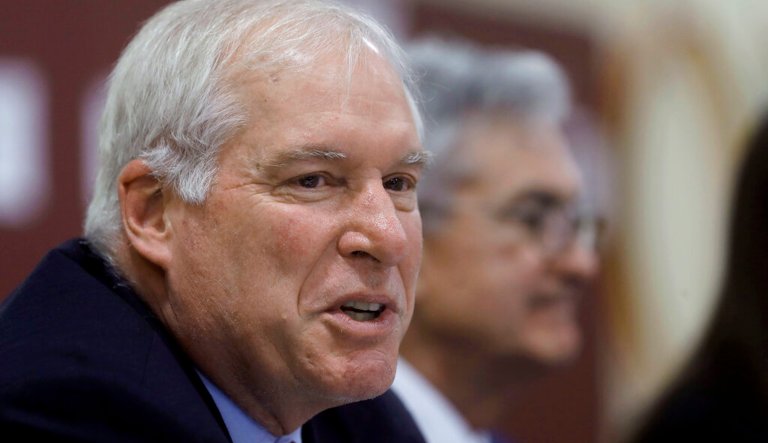 Federal Reserve Bank of Boston President Eric Rosengren, left, speaks during a round table discussion as Federal Reserve Board Chair Jerome Powell, right, looks on at Silver Lane Elementary School, in East Hartford, Conn., Monday, Nov. 25, 2019. Powell and Rosengren toured a working-class neighborhood in East Hartford Monday and met with residents to get a closer look at their challenges. 