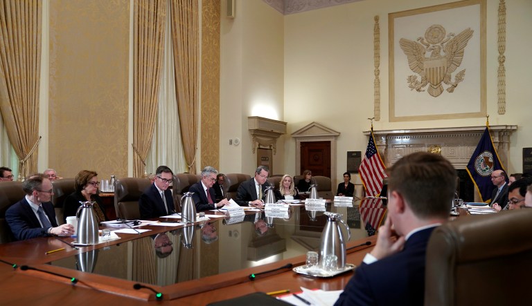The Federal Reserve Board, including chair Jerome Powell, fourth from left, holds a meeting to discuss proposed rules to modify the enhanced prudential standard framework for large banking organizations, Wednesday, Oct. 31, 2018, at the Marriner S. Eccles Federal Reserve Board Building in Washington.