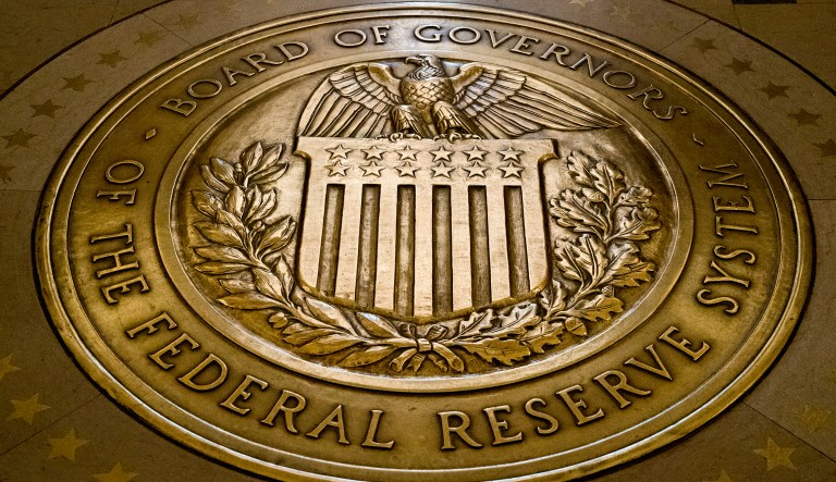 In this photo, the seal of the Board of Governors of the United States Federal Reserve System is displayed in the ground at the Marriner S. Eccles Federal Reserve Board Building in Washington.