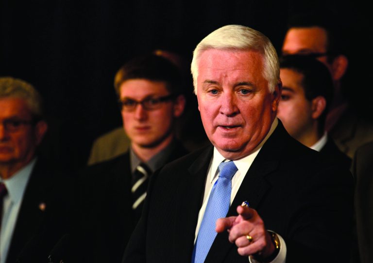 Pennsylvania Gov. Tom Corbett gestures while speaking at a news conference Wednesday, Jan. 2, 2013 in State College, Pa. The NCAA overstepped its authority by imposing hefty sanctions on Penn State University in the wake of the Jerry Sandusky child molestation scandal, Corbett said in announcing a federal lawsuit against the college athletics governing body. (AP Photo/Ralph Wilson)