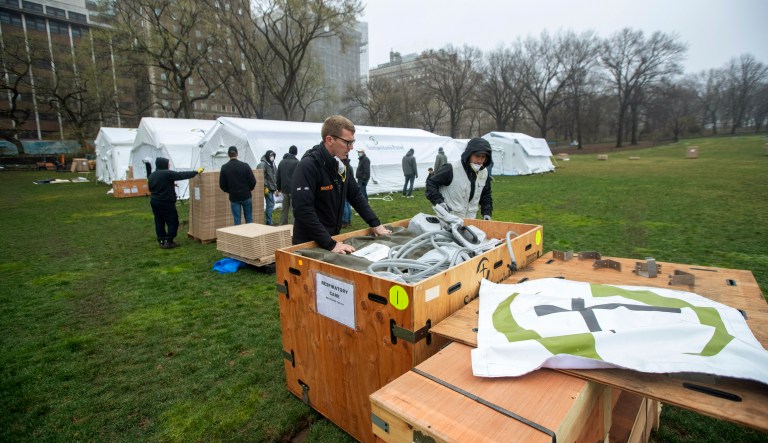 A Samaritanâs Purse crew works on building a 68 bed emergency field hospital specially equipped with a respiratory unit in New Yorkâs Central Park across from The Mount Sinai Hospital, Sunday, March 29, 2020.