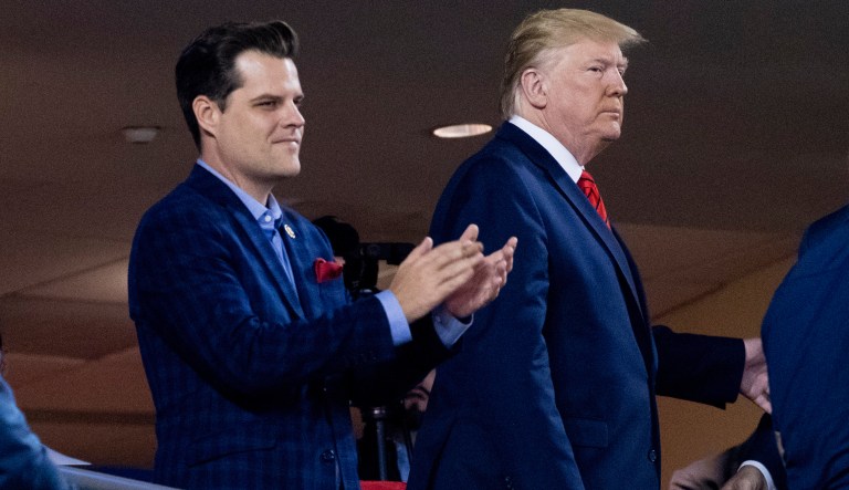 President Donald Trump (right) accompanied by Rep. Matt Gaetz (R-FL), arrive for Game 5 of the 2019 World Series baseball game between the Houston Astros and the Washington Nationals at Nationals Park in Washington.