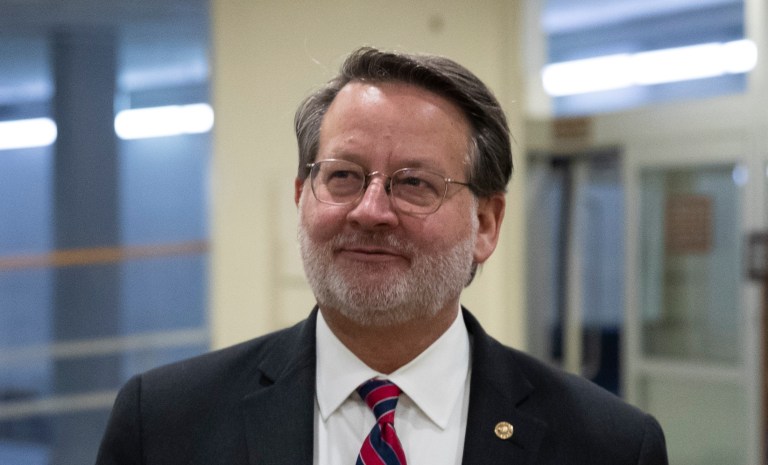 Sen. Gary Peters, D-Mich., talks with reporters on Capitol Hill, Tuesday, Feb. 4, 2020 in Washington. 