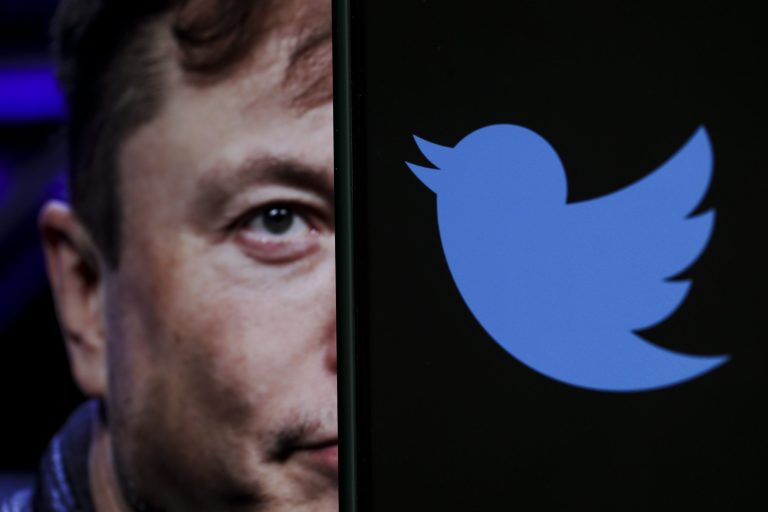 In this photo illustration, the image of Elon Musk is displayed on a computer screen and the logo of twitter on a mobile phone in Ankara, Turkey on Oct, 06, 2022. 