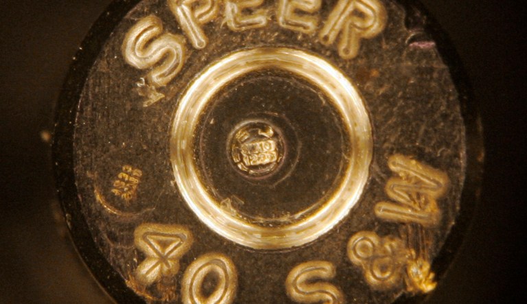 A bullet casing showing identification codes is shown through a microscope at a news conference  at the Los Angeles Police Academy on Aug. 14, 2007.