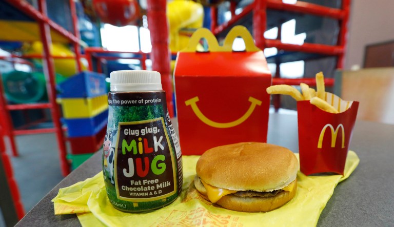 A Happy Meal featuring non-fat chocolate milk and a cheeseburger with fries, are arranged for a photo at a McDonald's restaurant in Brandon, Miss., Wednesday, Feb. 14, 2018.