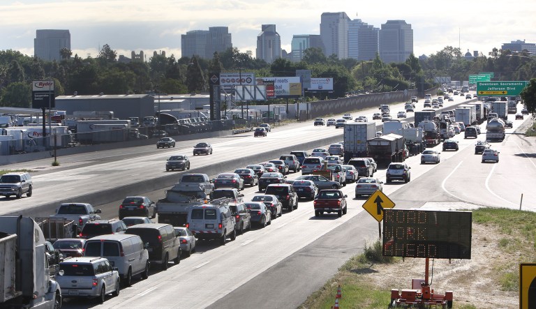FILE - In this April 22, 2014 file photos, drivers entering Sacramento on Highway 50 to come to a near stand still as traffic backs up in West Sacramento, Calif. The California Senate approved SB32, by Sen. Fran Pavley,D-Agoura, that sets a new goal to reduce greenhouse gas emissions to 40 percent below 1990 levels by 2030, Wednesday, Aug. 24, 2016. The bill now goes to the governor.