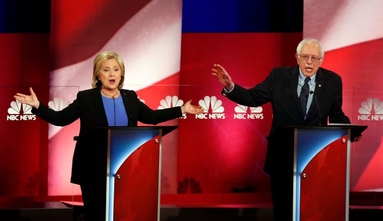 Former Secretary of State Hillary Clinton (left) and Sen. Bernie Sanders (I-VT, right) talk over each other during the Democratic presidential primary debate at the Gaillard Center on Jan. 17, 2016, in Charleston, South Carolina.
