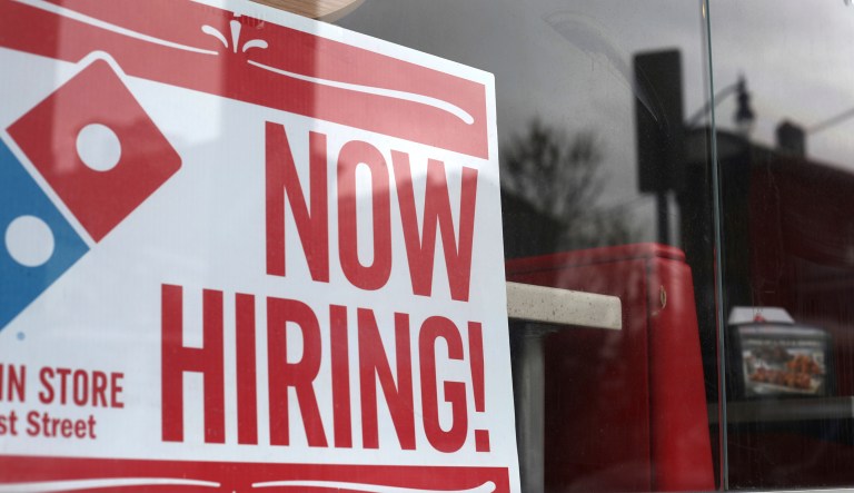In this April 14, 2019, photo a now hiring sign is posted at a Domino's Pizza in Jersey City, N.J. On Wednesday, May 1, payroll processor ADP reports how many jobs private employers added in April.