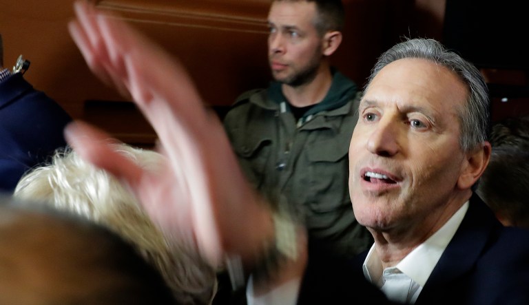Former Starbucks CEO Howard Schultz shakes hands after speaking, Thursday, Jan. 31, 2019, at an event to promote his book, "From the Ground Up," in Seattle. Schultz has faced a rocky reception since he announced earlier in January that he's considering an independent presidential bid.