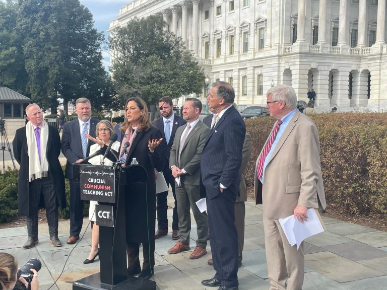 Michael Sussman (purple tie) arrives at U.S. District Court for the District of Columbia