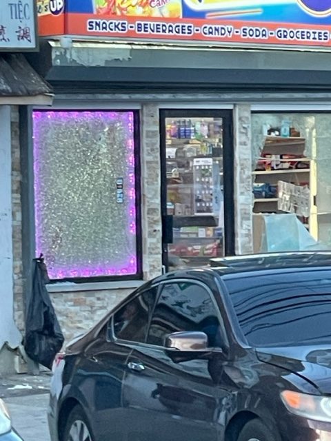 Convenience store window after a drive-by shooting in Philadelphia on Monday