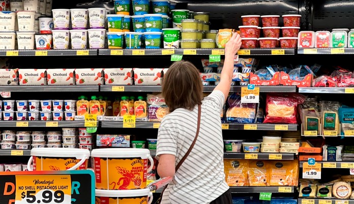 A shopper peruses cheese offerings at a Target store Wednesday, Oct. 4, 2023.
