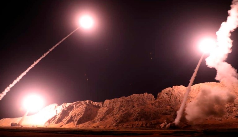 In this photo released on Monday, Oct. 1, 2018, by the Iranian Revolutionary Guard, missiles are fired from city of Kermanshah in western Iran targeting the Islamic State group in Syria. Iran's paramilitary Revolutionary Guard said Monday it launched ballistic missiles into eastern Syria targeting militants it blamed for a recent attack on a military parade.