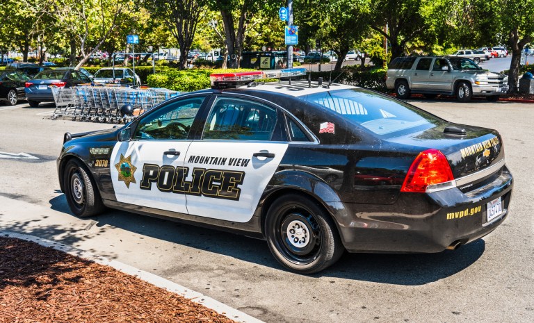 August 8, 2019 â Mountain View, California: Police car stationed outside a Walmart store.