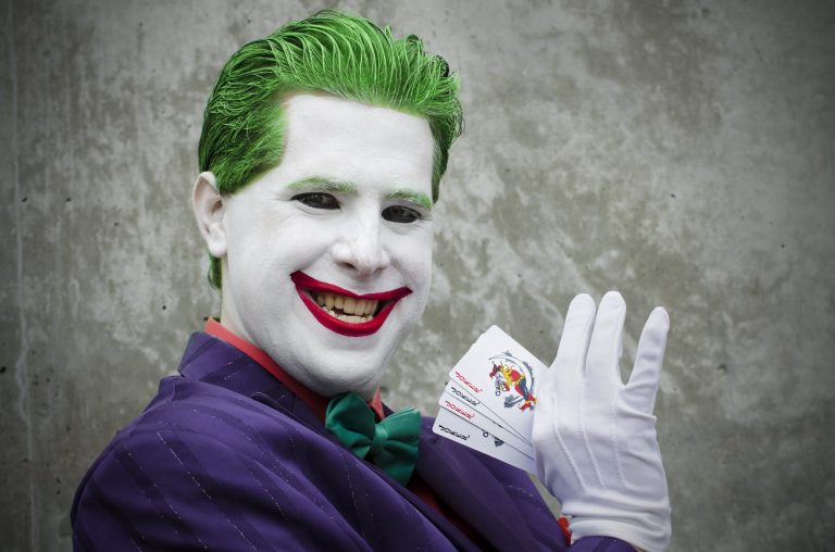 A cosplayer is shown dressed as the Joker from Batman at FanimeCon 2012 in San Jose, California.