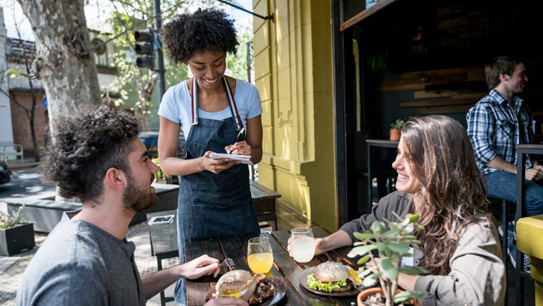 A waitress in a restaurant.