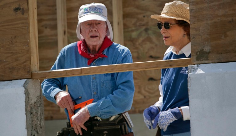 Former U.S. President Jimmy Carter, left, and his wife Rosalynn visit a Habitat for Humanity project in Leogane, Haiti, Monday Nov. 7, 2011.