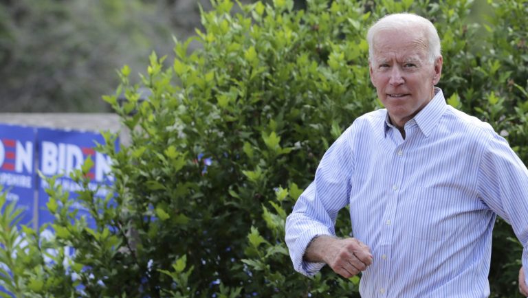 Democratic presidential candidate former Vice President Joe Biden waits to speak to local residents during a bus tour stop, Tuesday, Dec. 3, 2019, in Mason City, Iowa.
