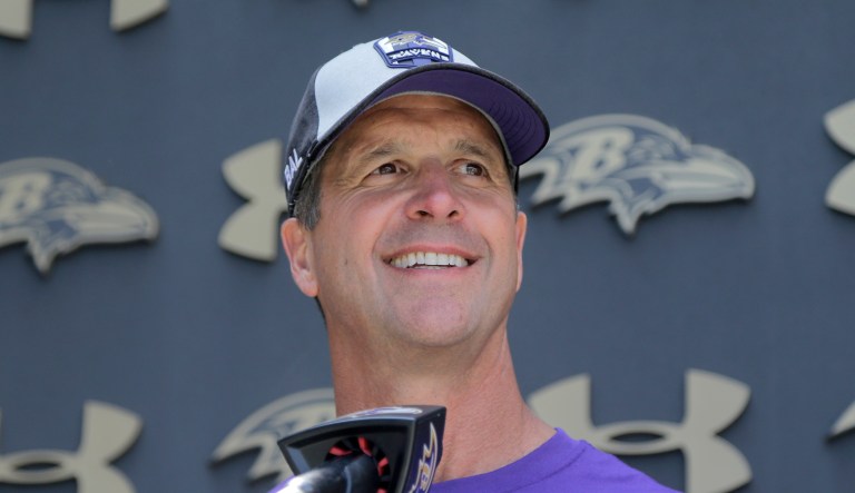 Baltimore Ravens head coach John Harbaugh talks to reporters during NFL football training camp, Friday, July 26, 2019, in Owings Mills, Md.