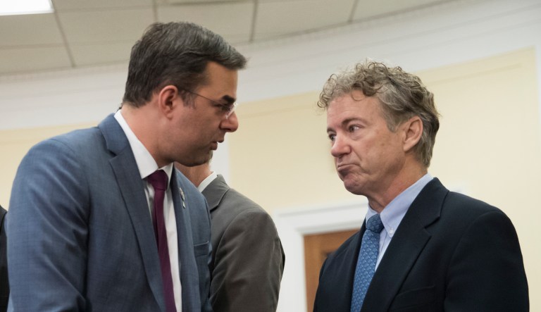 Rep. Justin Amash, R-Mich., center left, confers with Sen. Rand Paul, R-Ky.