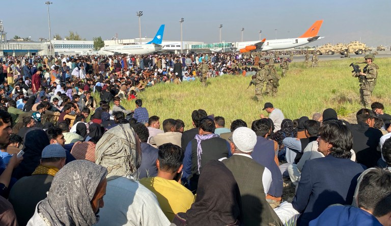 U.S soldiers stand guard inside the international airport in Kabul, Afghanistan, Monday, Aug. 16, 2021. Thousands of Afghans have rushed onto the tarmac at the airport, some so desperate to escape the Taliban capture of their country that they held onto the American military jet as it took off and plunged to death. 