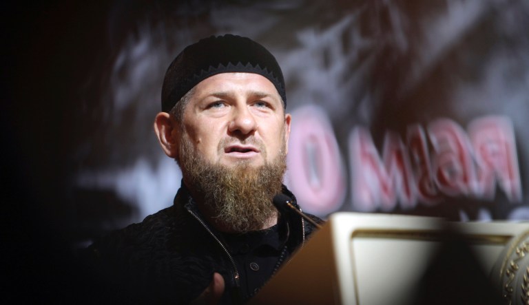 Chechnya's regional leader Ramzan Kadyrov speaks in front of a portrait of his father Akhmad Kadyrov, the Chechen president who was assassinated in a 2004 bomb blast, during a meeting in Grozny, Russia, Friday, May 10, 2019.